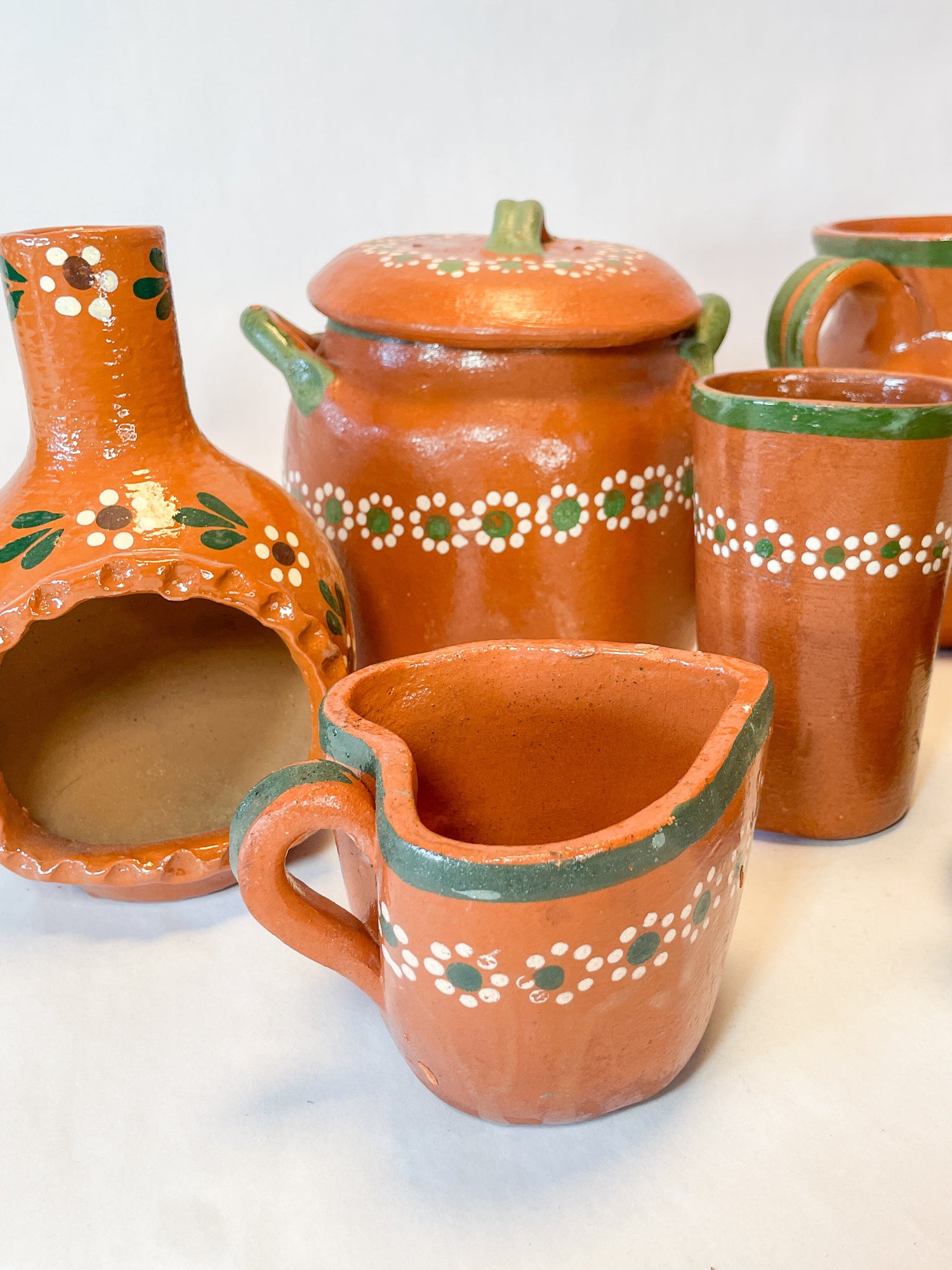 Traditional Mexican clay pottery featuring a beautifully crafted red clay pot